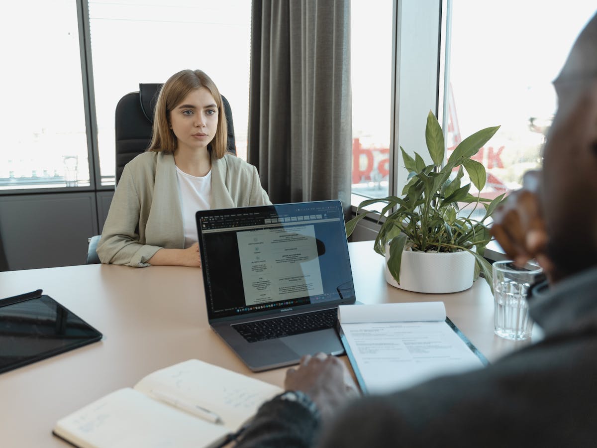 Hiring interview between a recruiter and a candidate in a bright office