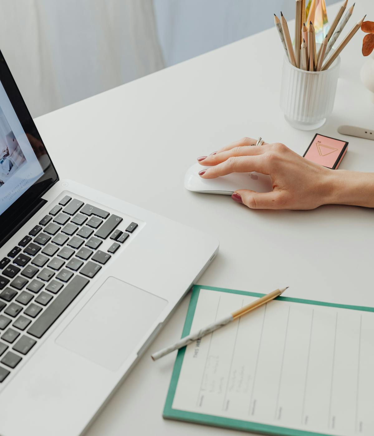 Minimal laptop workspace with business notes and desk accessories