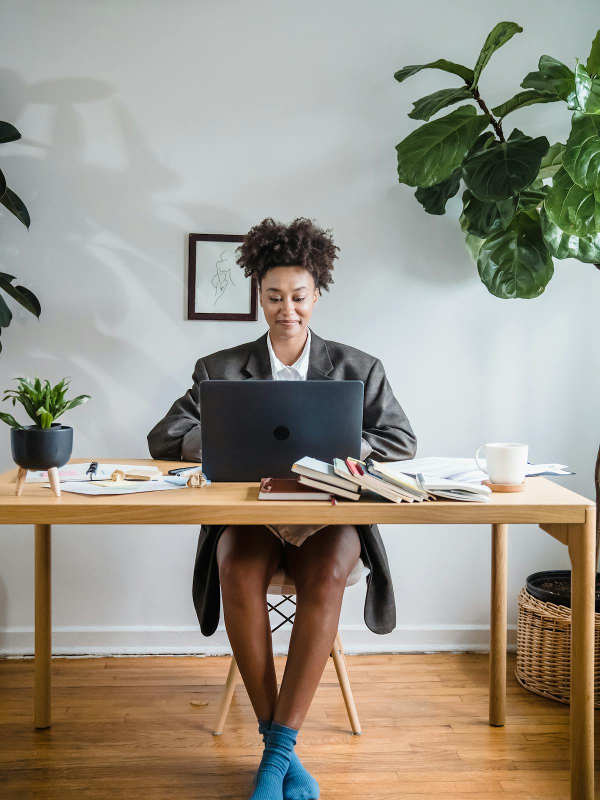 Professional remote worker using a laptop in a bright home office
